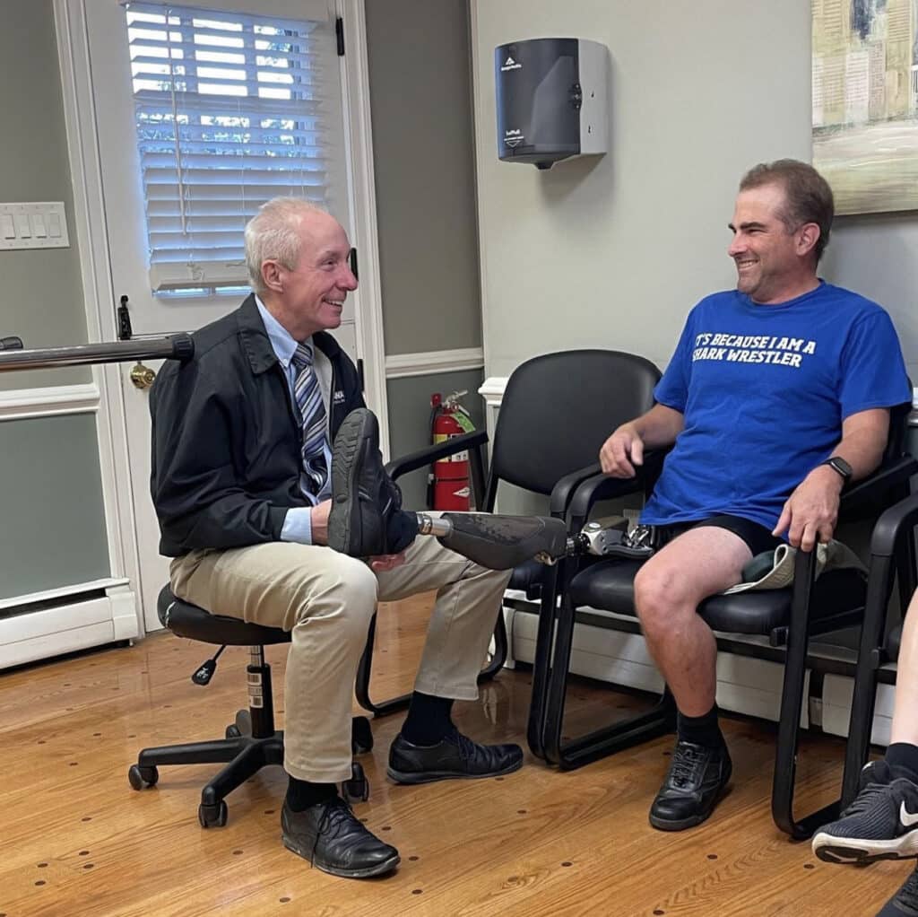 prosthetist listening to patient