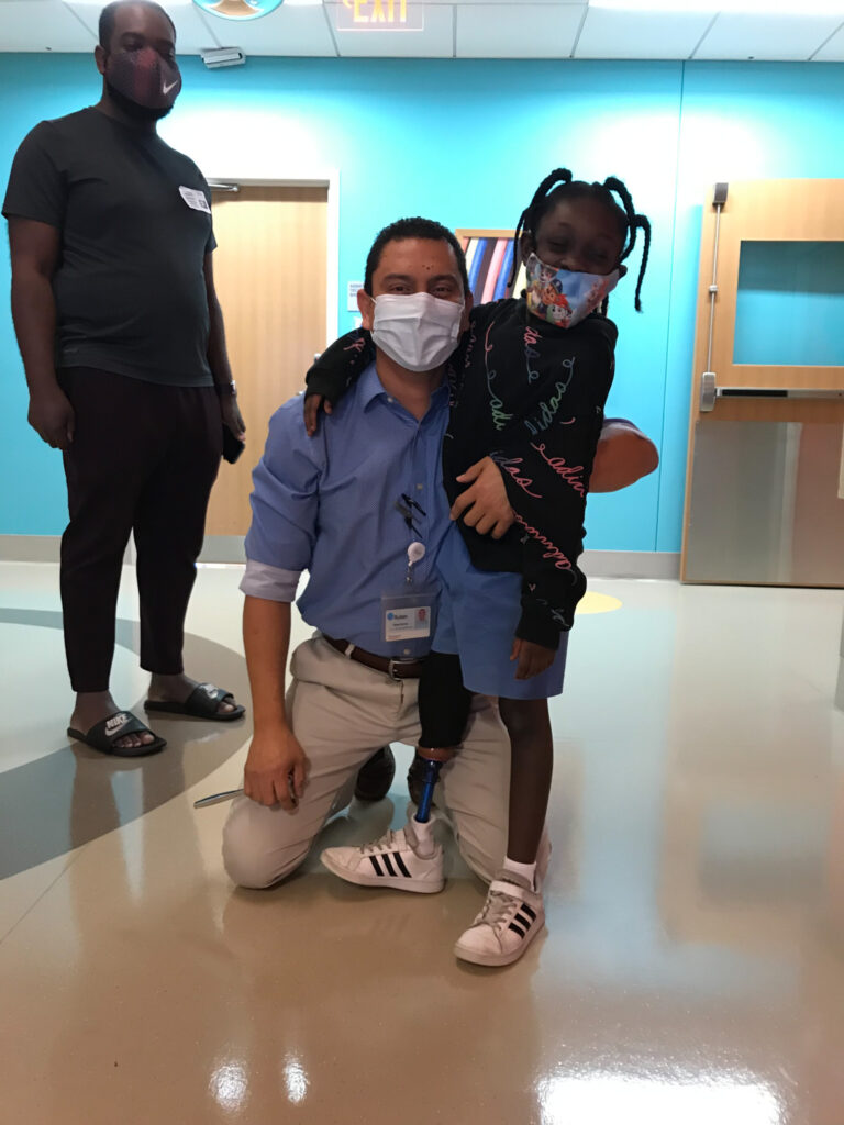 prosthetist with child